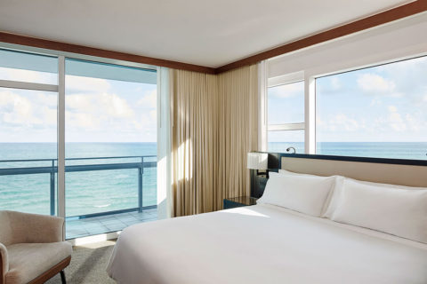 corner of a luxury suite with ocean view and balcony