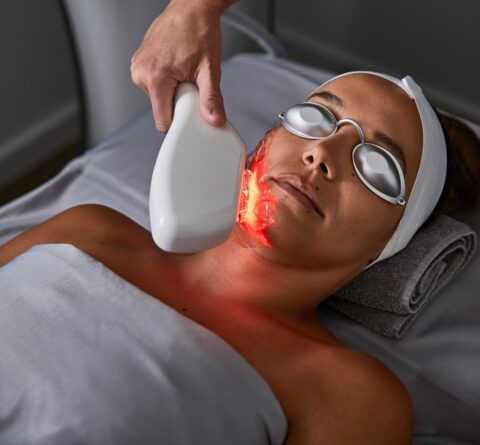 Woman wearing silver goggles as she gets a Thermafacial